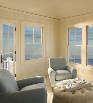 white wood windows looking out to the sea